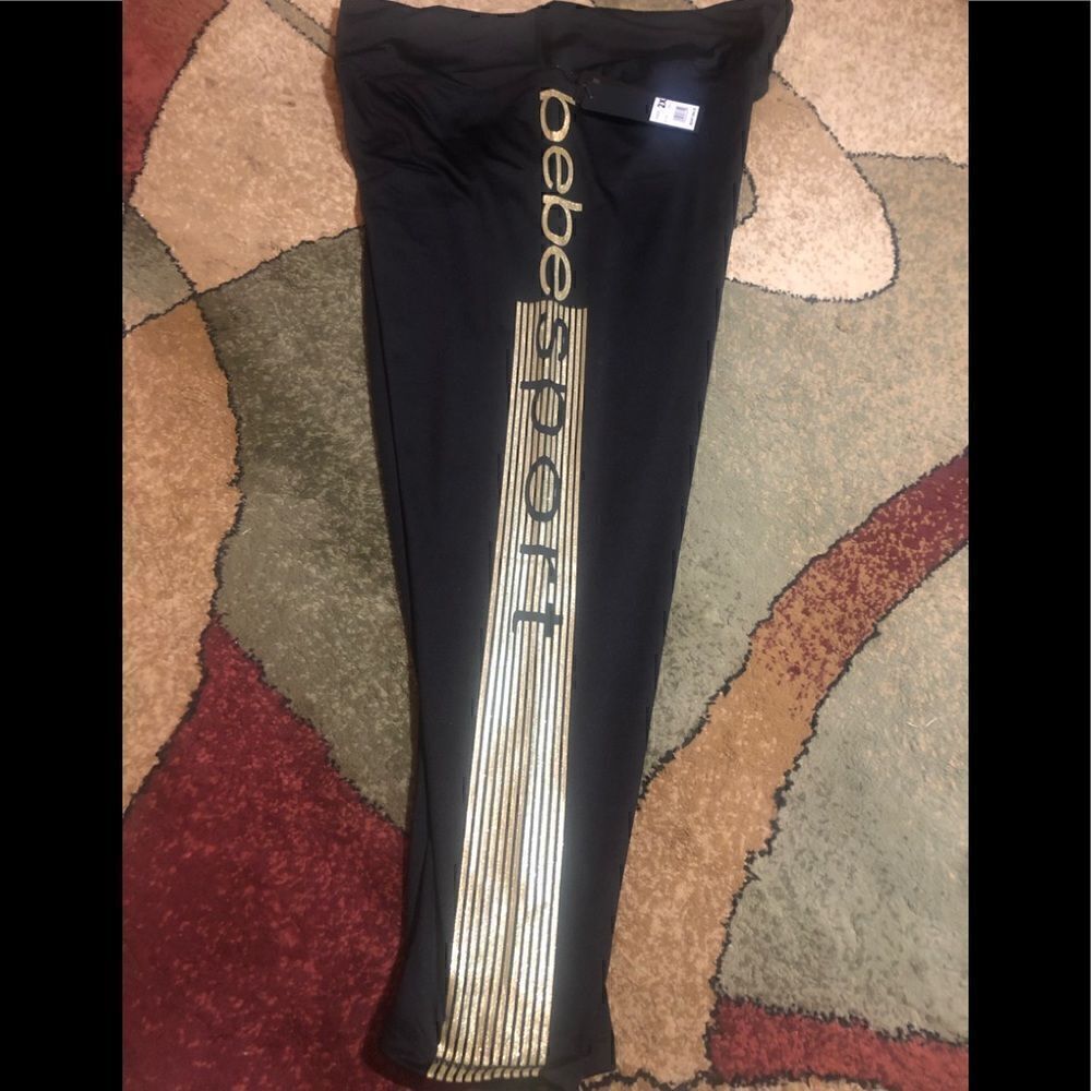 NWT BEBE SPORT joggers with gold wide logo .